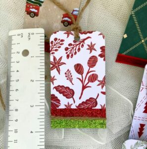 One Gift Tag Next To A Ruler Showing The Height